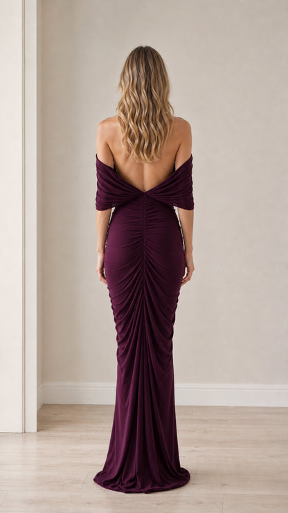 Back view showcasing the open back and draping