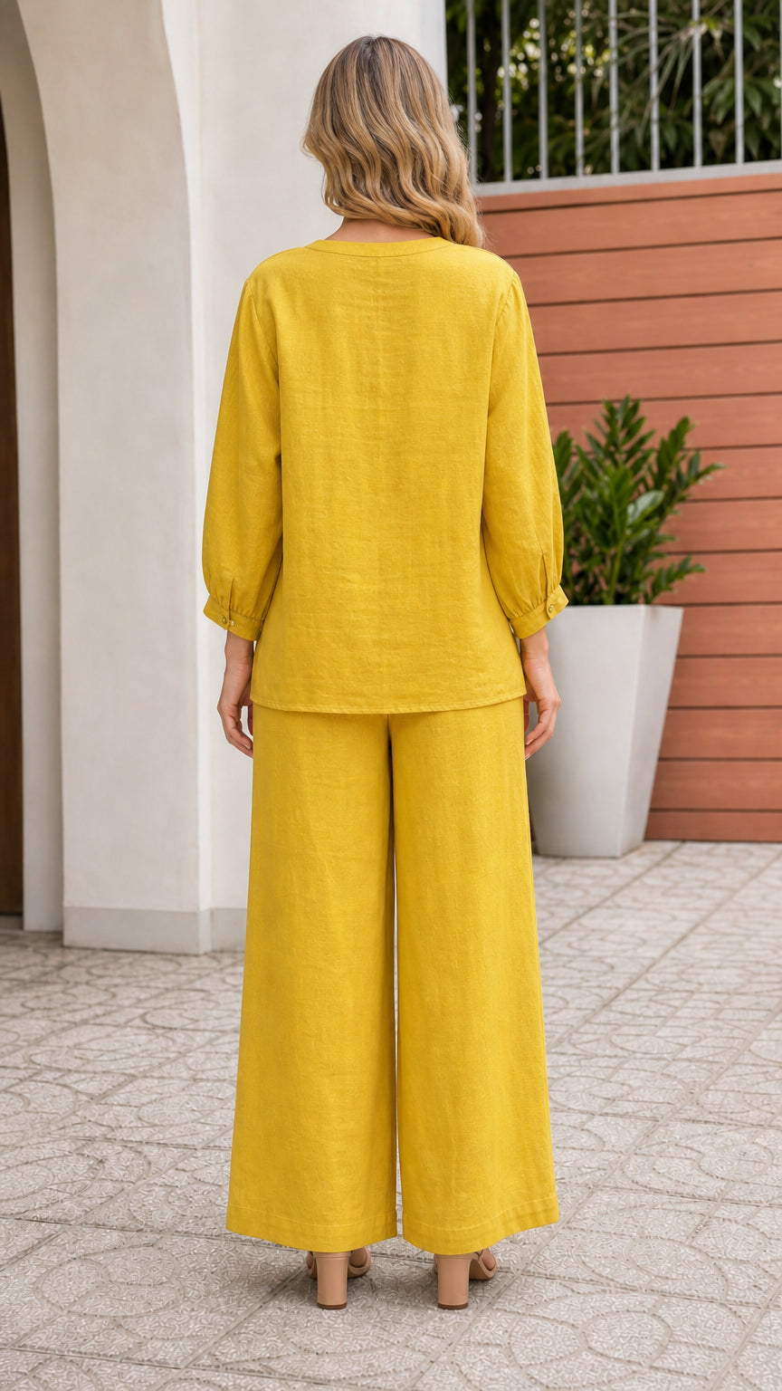 Back view of woman wearing yellow matching set