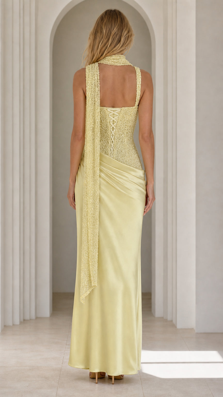 Back view showing lace-up corset detail on yellow dress