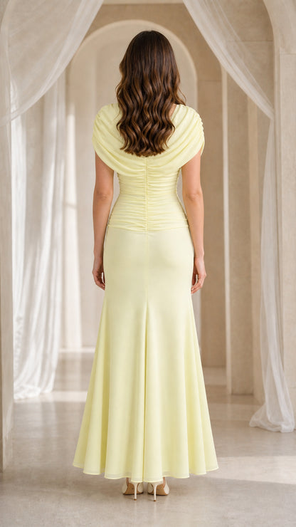 Back view of yellow maxi dress showing train and back draping