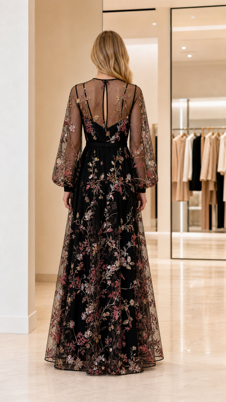 Back view of woman wearing black sheer-sleeve embroidered dress