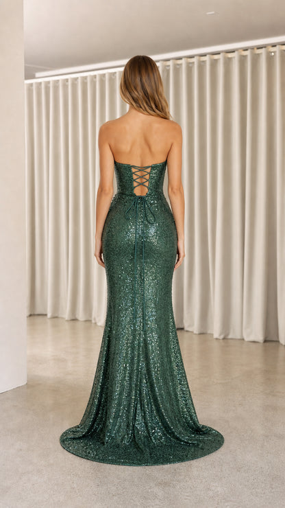 Back view of emerald green evening dress highlighting lace-up corset detail