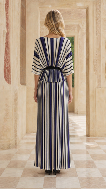 Back view of woman in blue striped maxi set