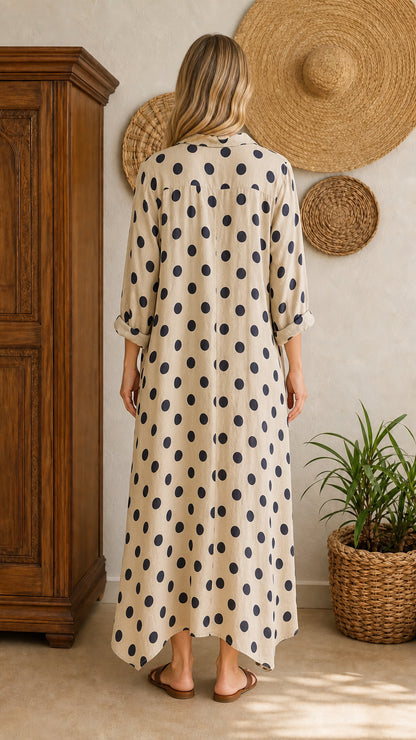 Back view of beige polka dot maxi shirt dress on model