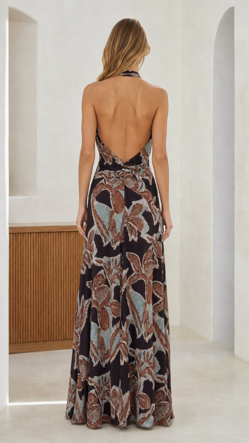 Back view showcasing open back design of the black maxi dress