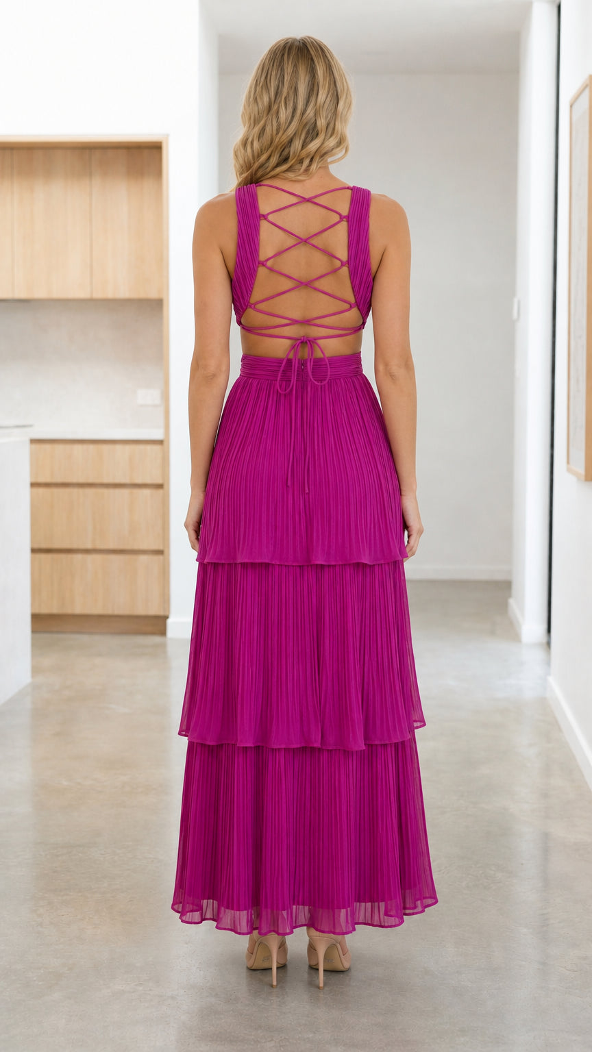 Back view showcasing lace-up back detail on Fuchsia maxi dress