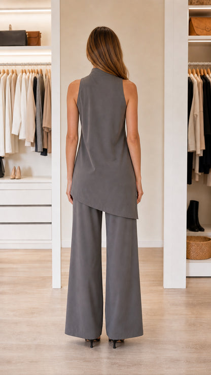 Back view of model in charcoal pant set highlighting asymmetric hem