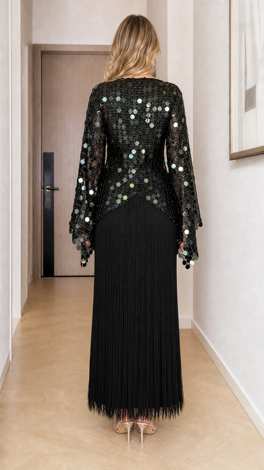 Back view of black sequin bell sleeve maxi dress