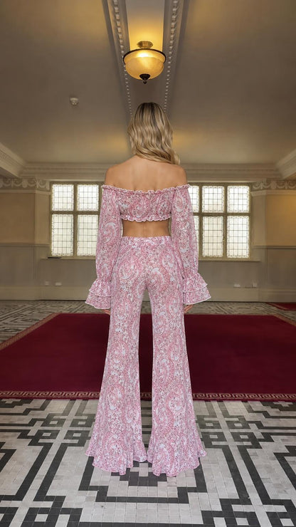 Model back view wearing pink paisley matching set