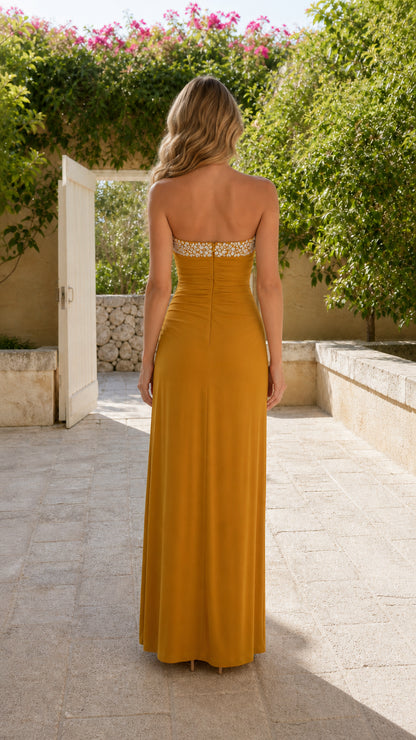 Back view of mustard yellow strapless evening dress