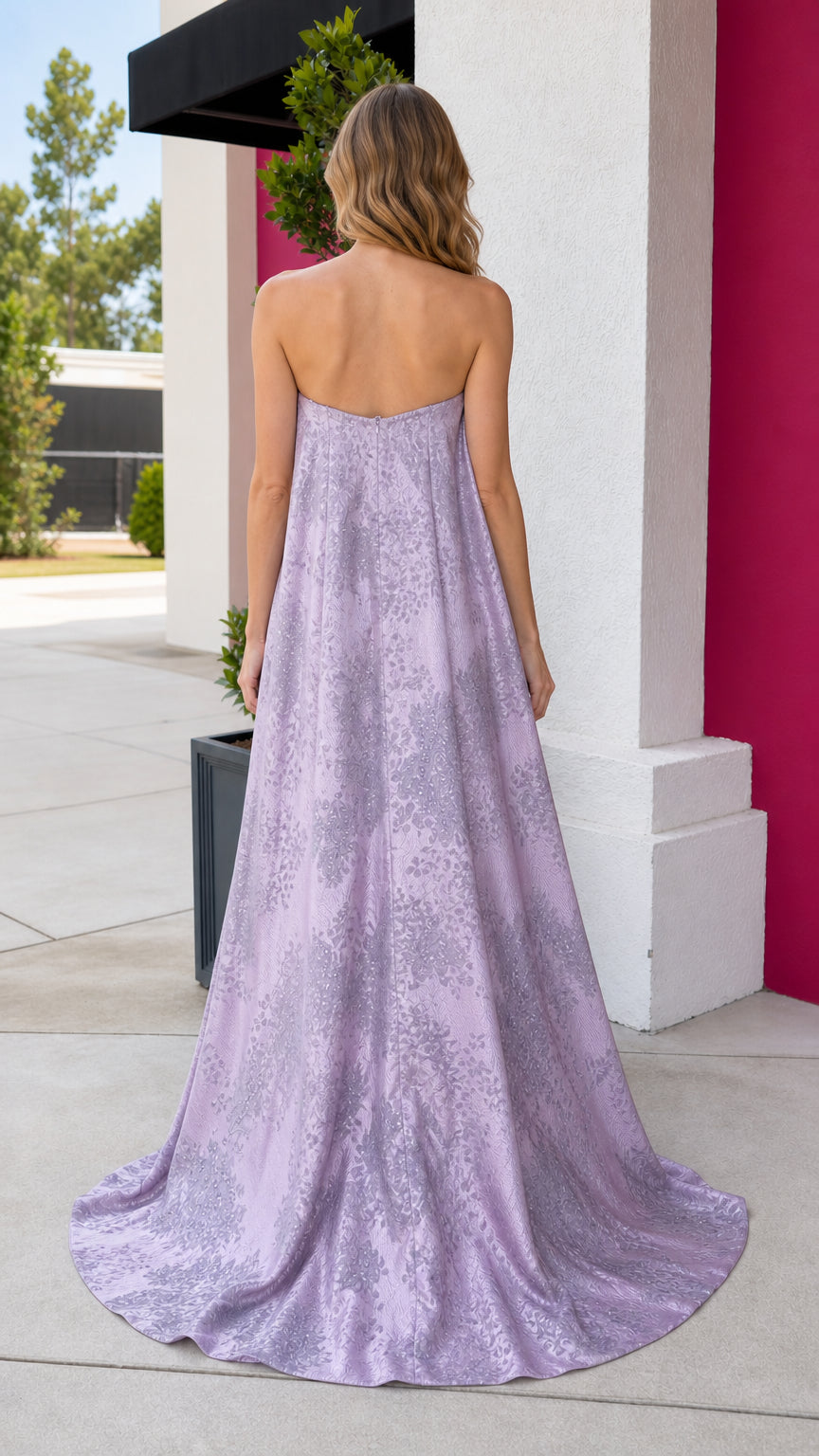Back view showing sweeping cape and train on lavender gown