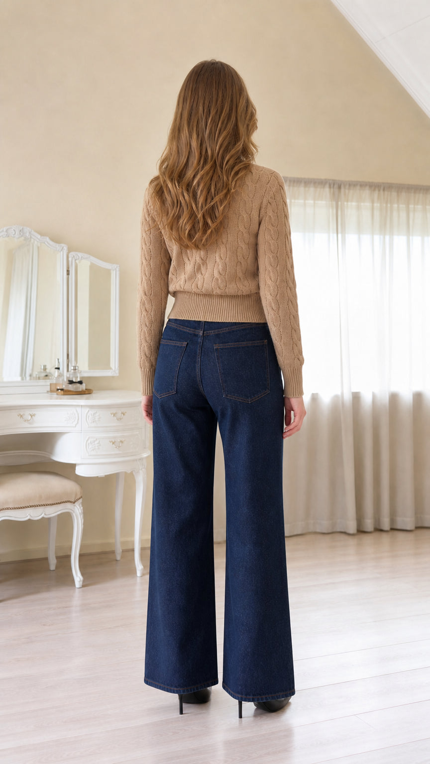 Back view of women's camel cable-knit cardigan sweater