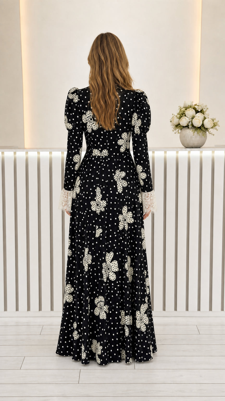 Back full view of black long sleeve floral polka dot maxi dress