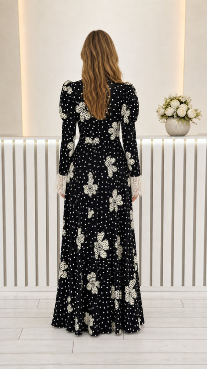 Back full view of black long sleeve floral polka dot maxi dress