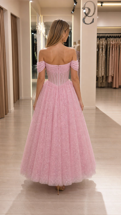 Back view showing structured corset details of pink midi dress