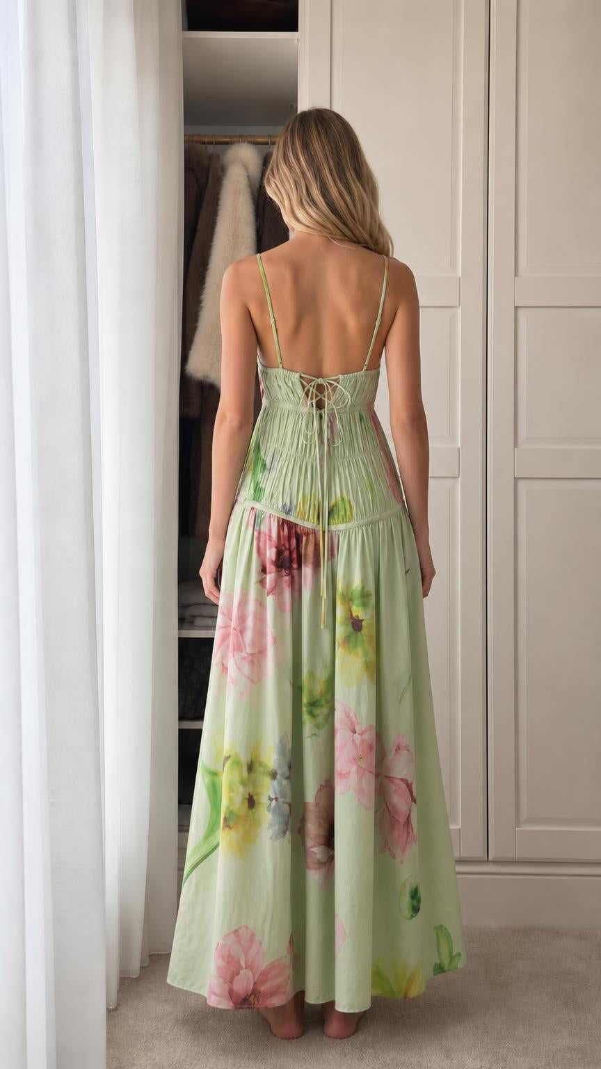 Model wearing green floral print smocked maxi dress back view