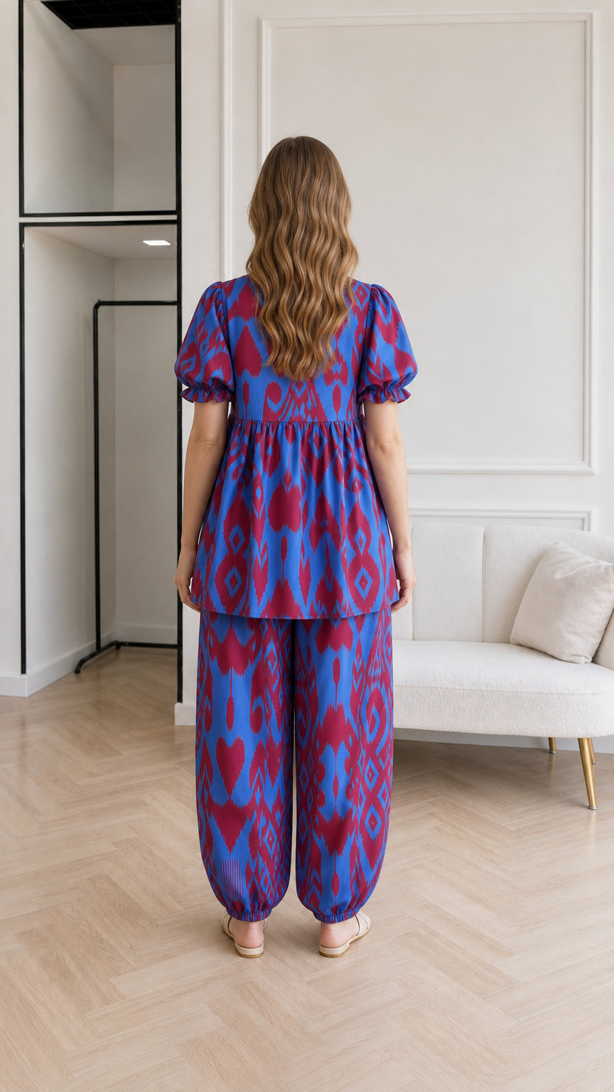 Back view of woman wearing Royal Blue ikat matching tunic top and elastic cuff trousers