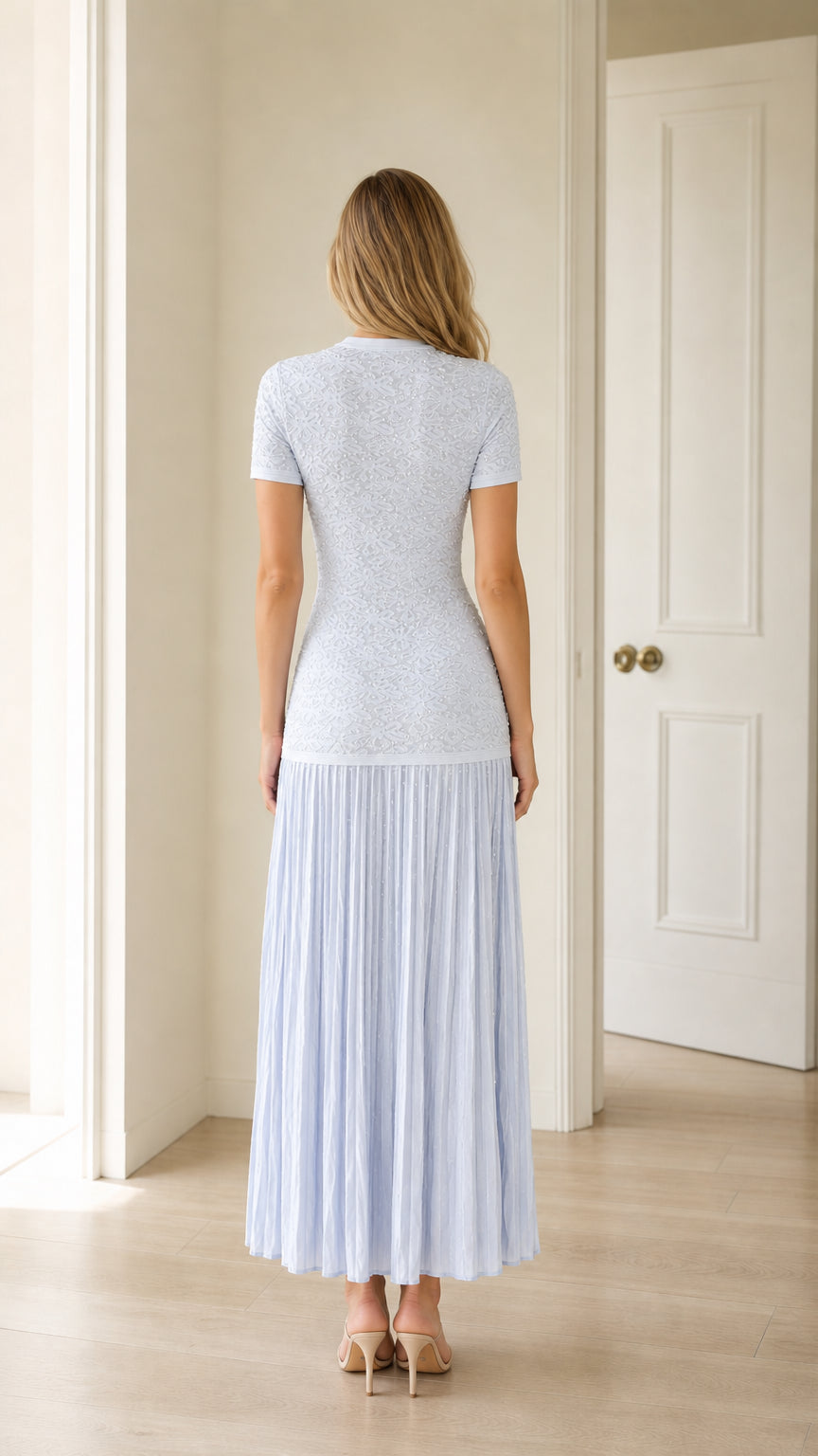 Back view of light blue pleated midi dress