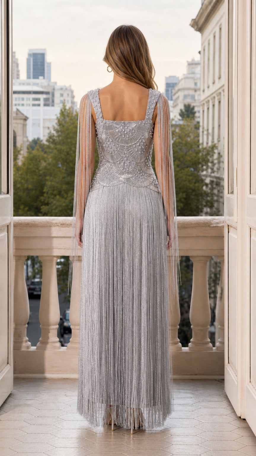 Back view of woman wearing silver beaded fringe maxi formal gown