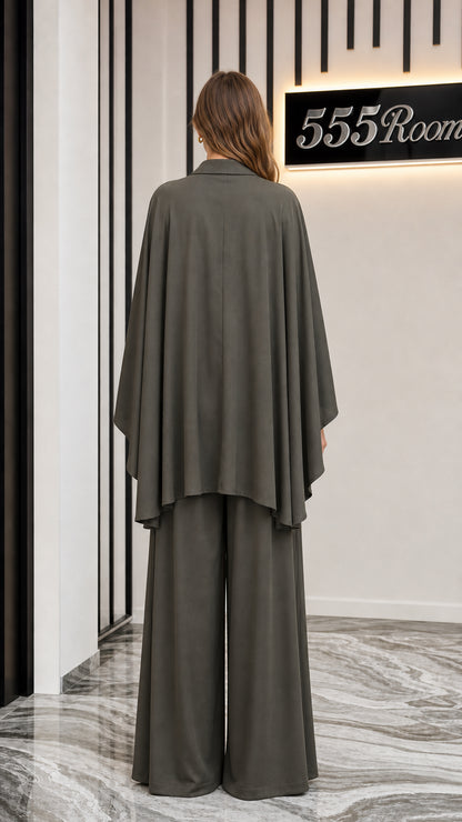 Back view of model showing cape-style sleeves in olive