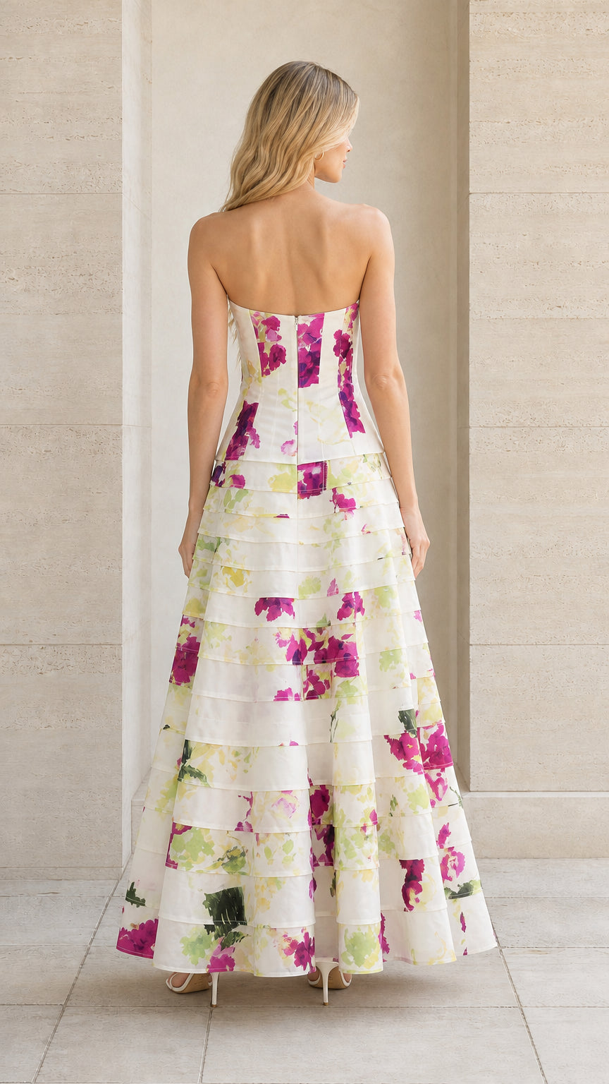 Back view of strapless tiered maxi gown showing tailored fit and floral pattern