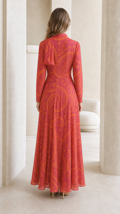 Model wearing pink paisley maxi dress, back view