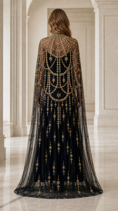 Back view of model showcasing flowing beaded cape