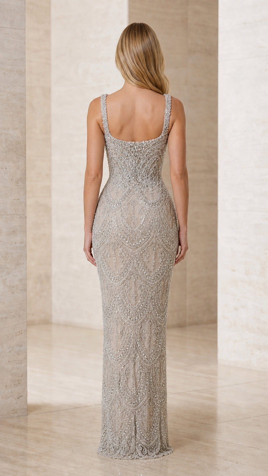 Back view of model in Silver beaded sleeveless formal maxi dress