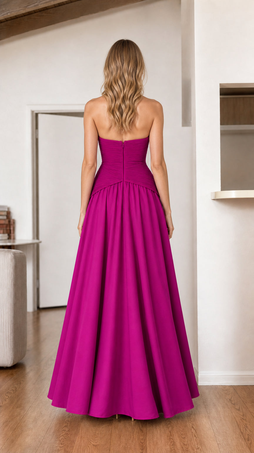 Back view of magenta strapless A-line evening gown showing clean tailored back fit