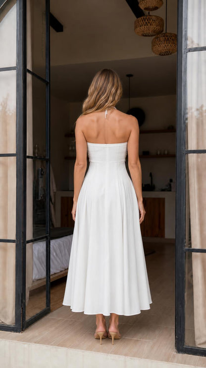 Back view showcasing open back design of white maxi dress