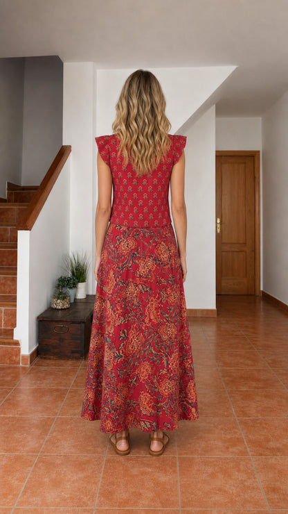 Back view of model wearing Rust Red floral sleeveless maxi dress