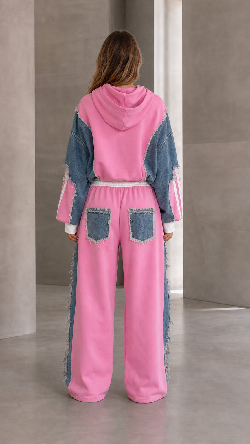 Back view of pink denim patchwork hoodie and wide leg pants with denim back pockets