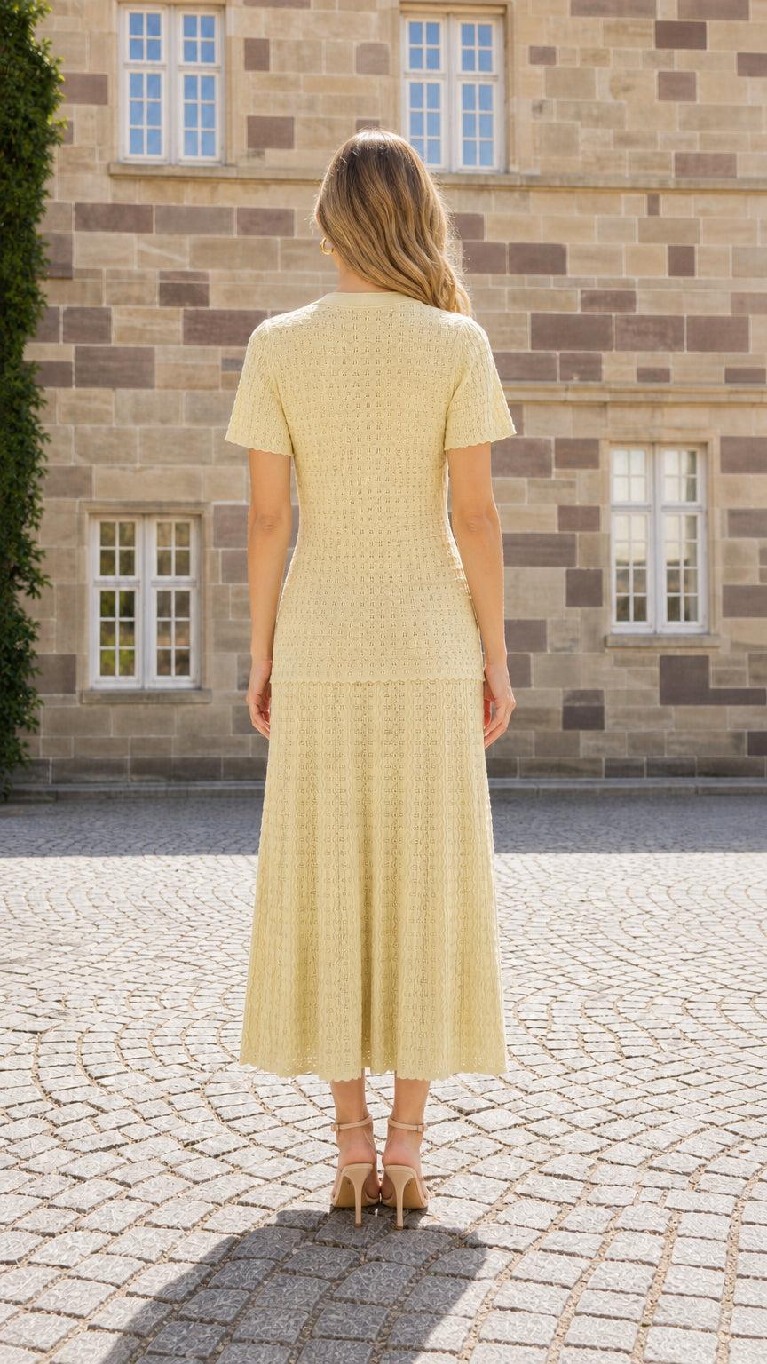 Back view of model wearing yellow textured knit midi dress