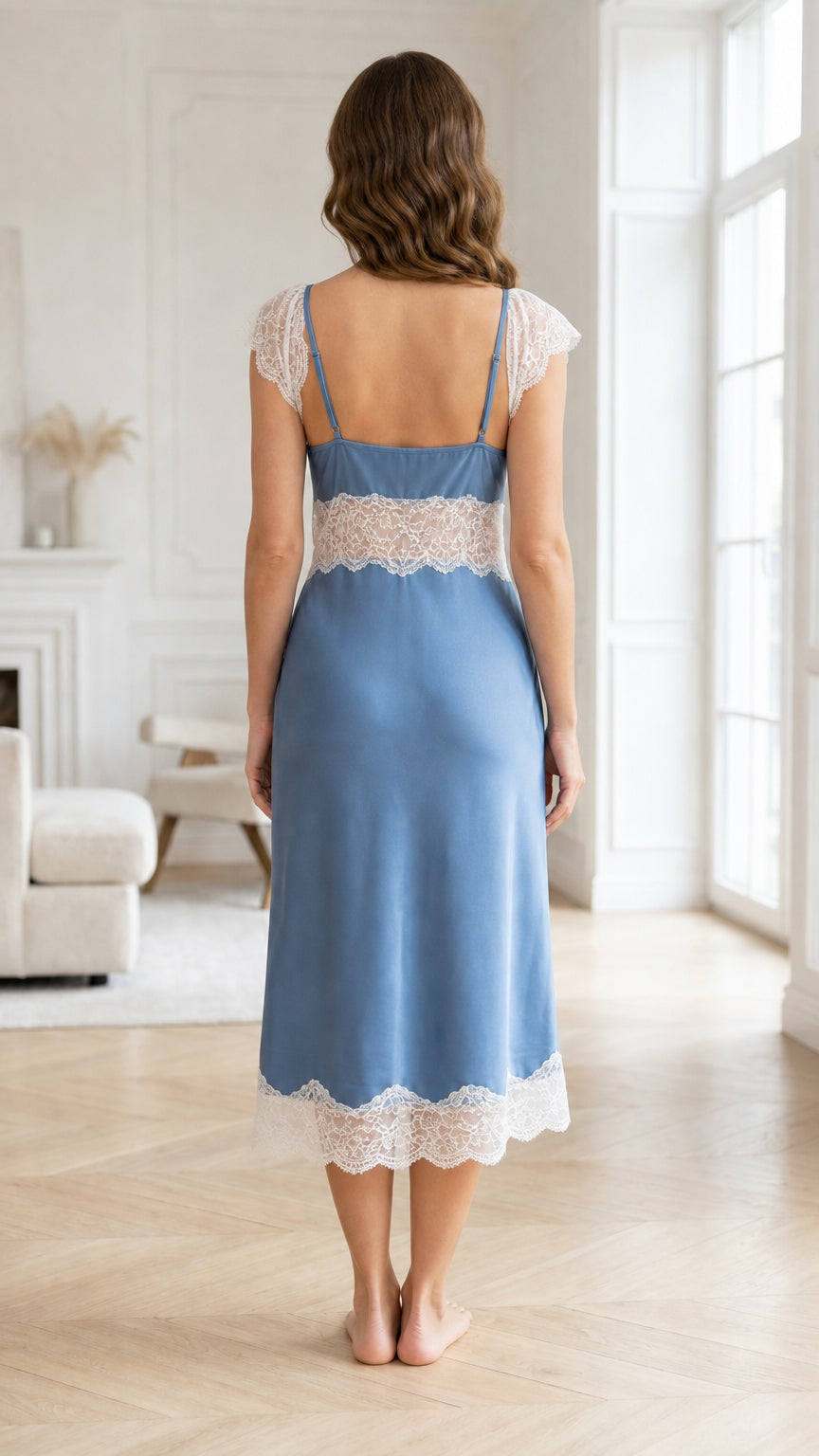 Back view of woman wearing blue satin nightgown with lace hem