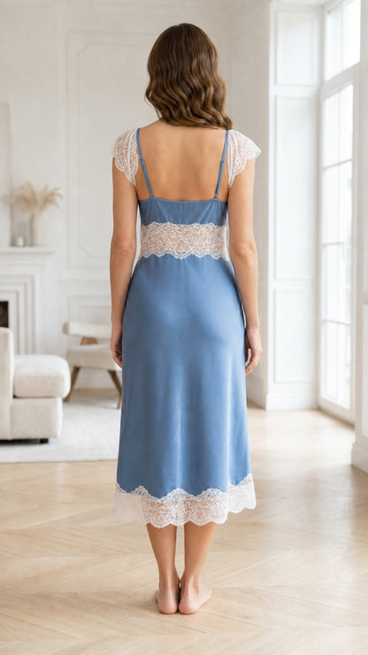 Back view of woman wearing blue satin nightgown with lace hem