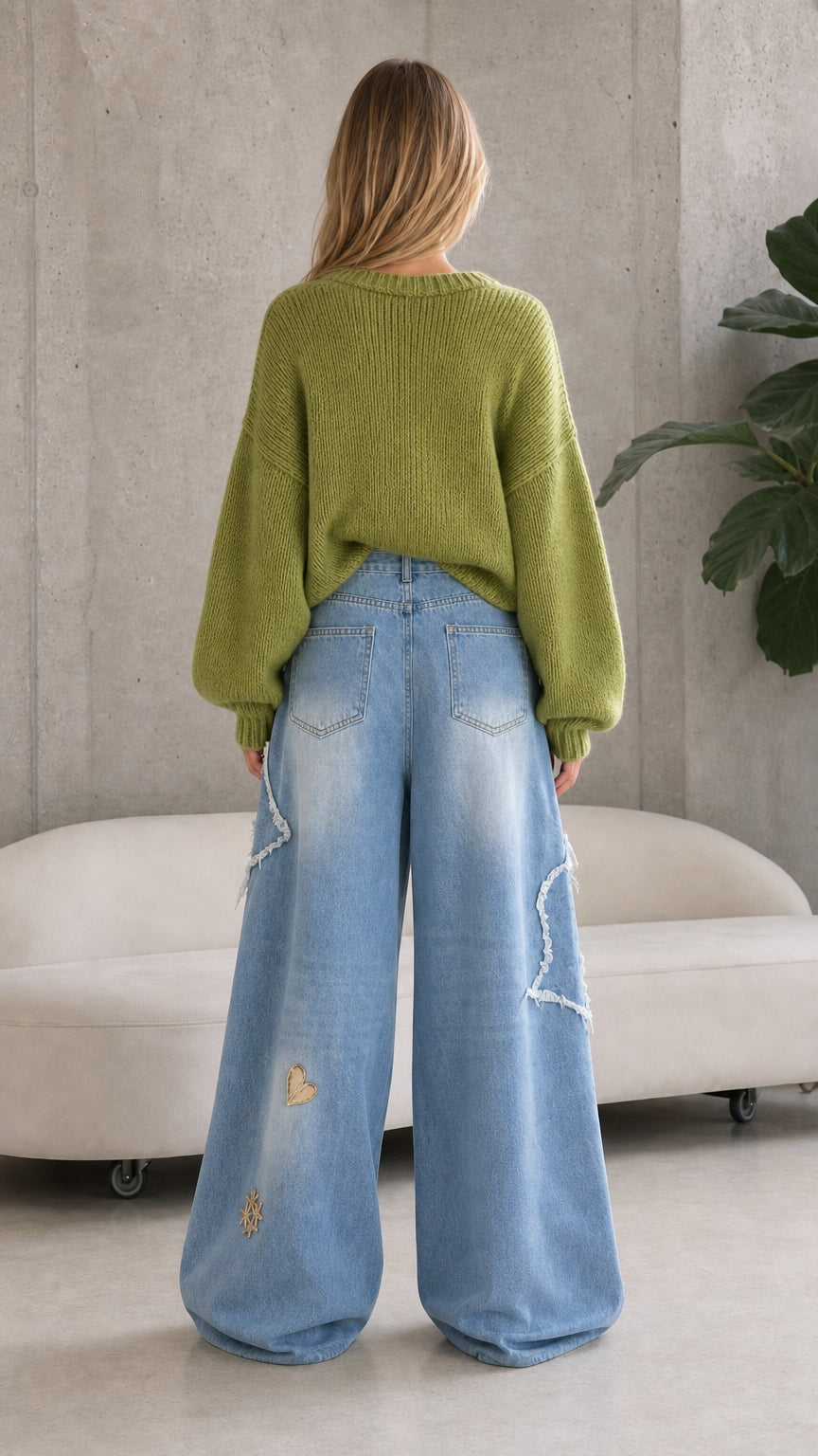 Back view of light blue star patch wide leg jeans showing pocket placement and relaxed fit