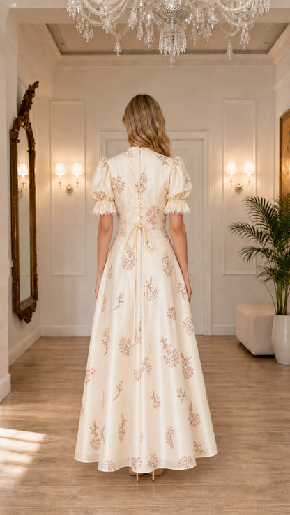 Model wearing cream floral embroidered puff sleeve maxi dress, back view