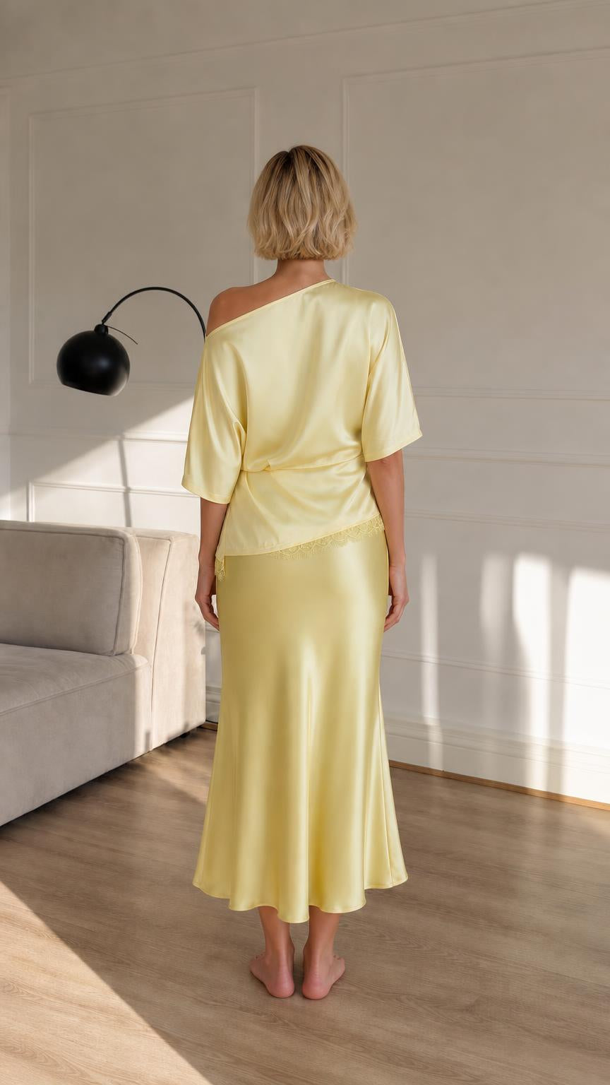 Woman wearing yellow satin set back view