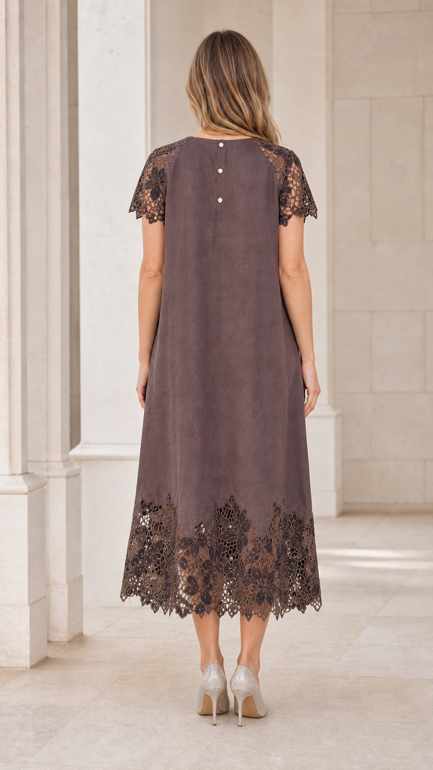 Back view of model showing back button closure on taupe midi dress