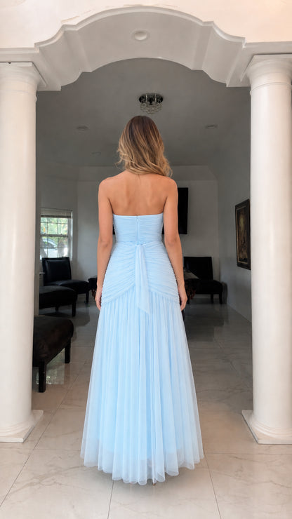 Back view of model showing lace-up back detail on light blue gown