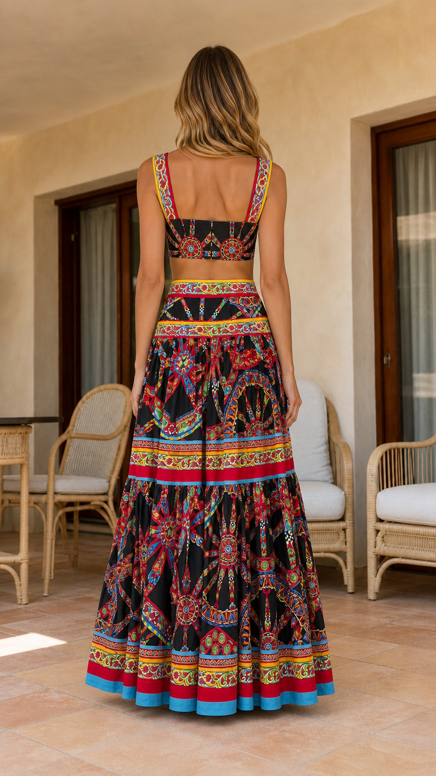 Back view of model showcasing tiered maxi skirt and cropped top