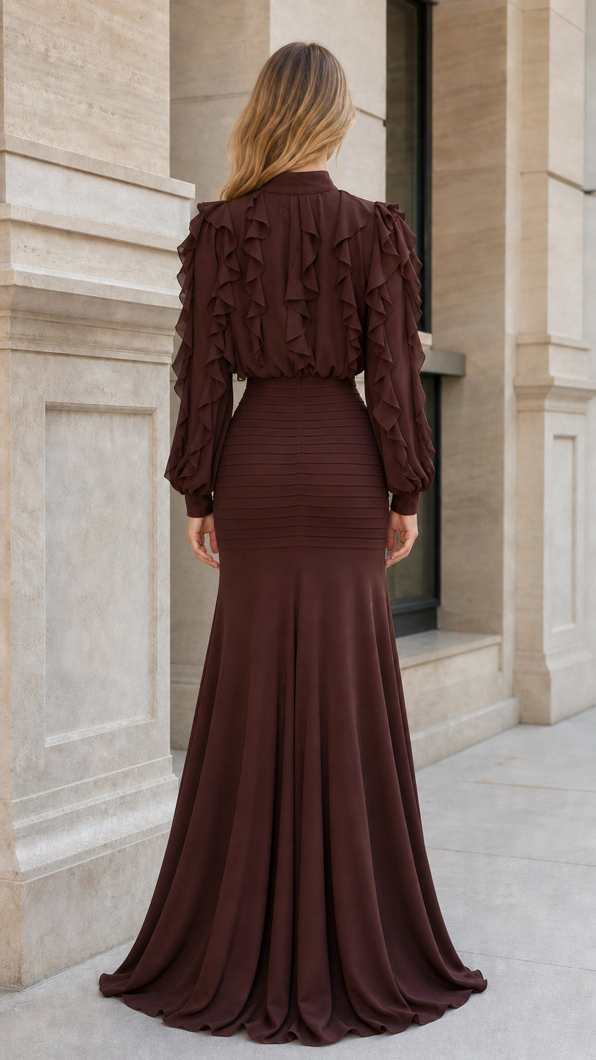 Back view of woman in brown ruffled maxi dress