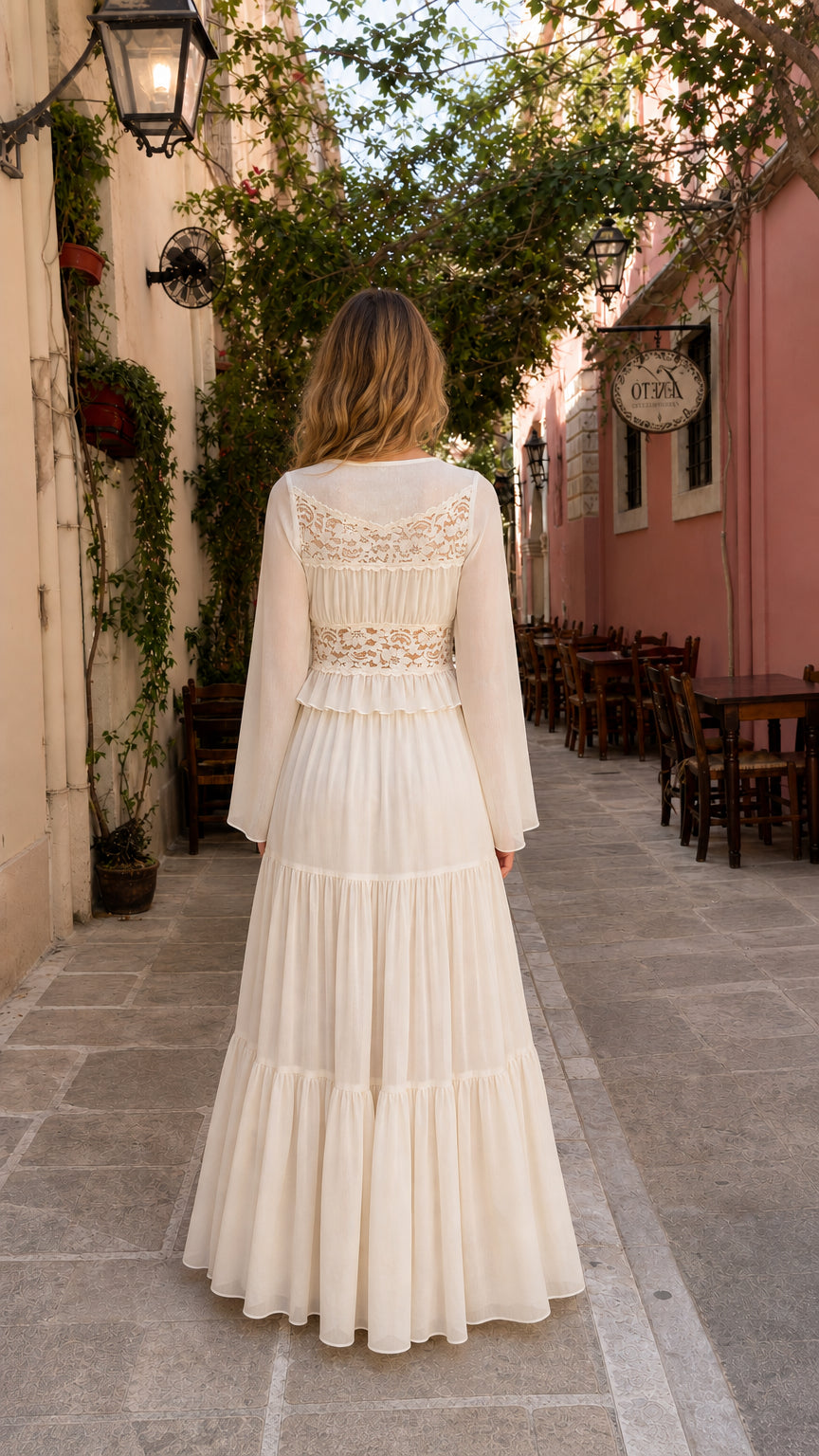 Back view of woman in cream boho lace trim maxi dress