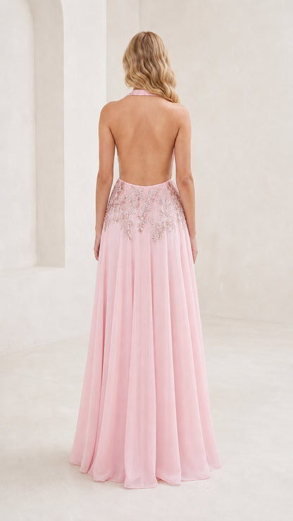 Back view showing open back design of pink gown