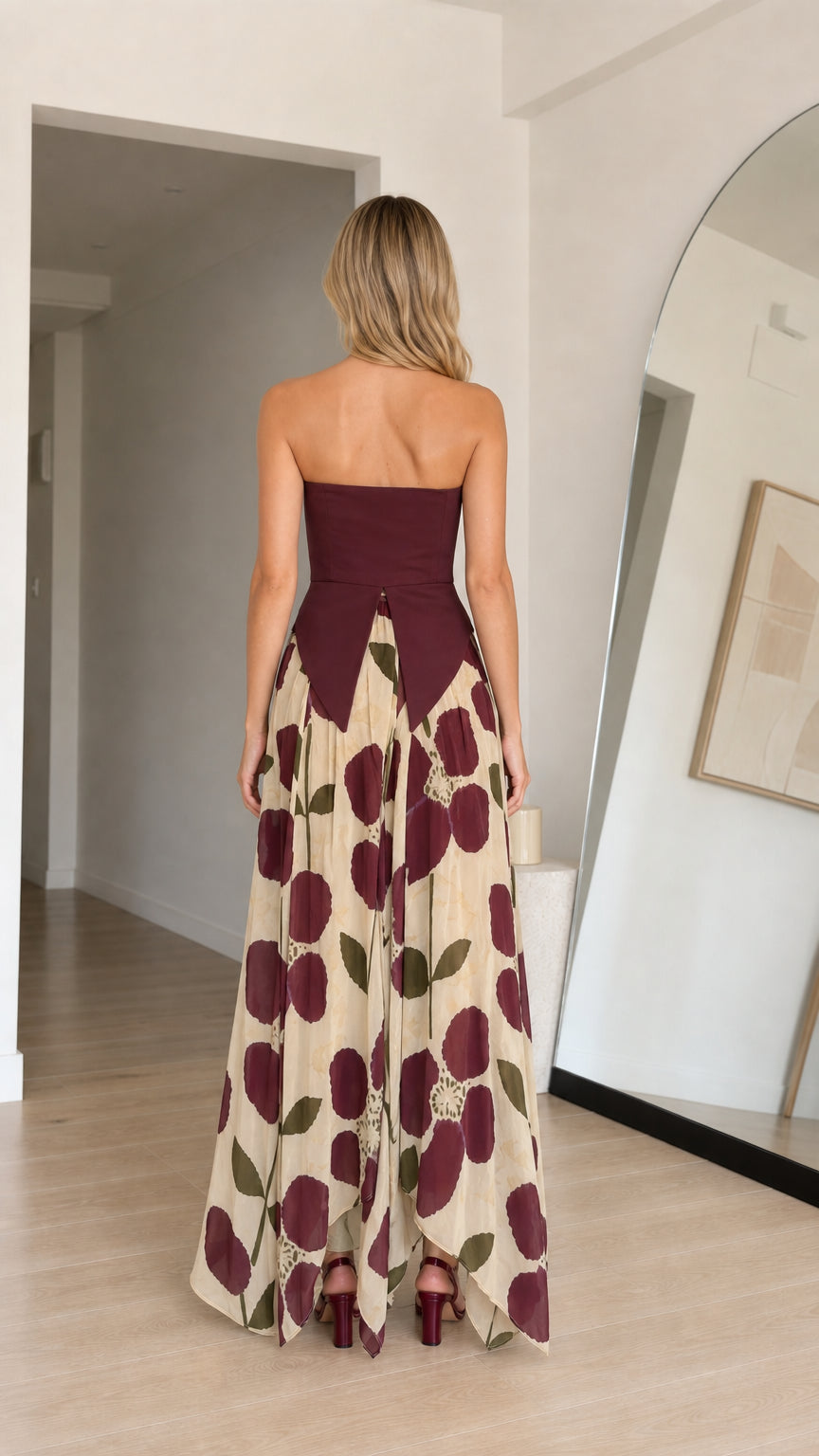 Back view of model showing back detail of burgundy floral maxi dress
