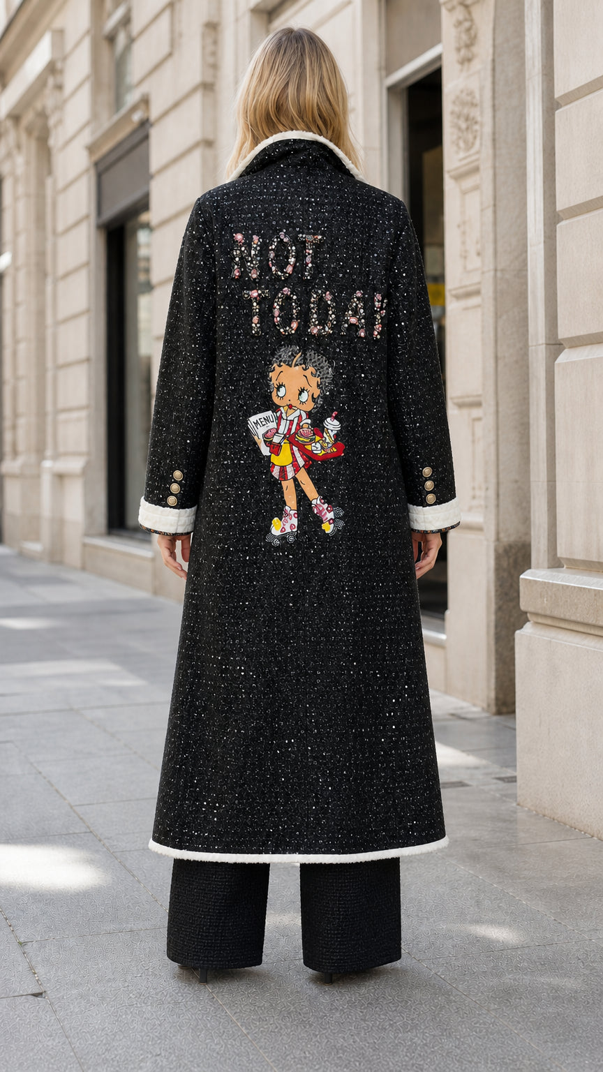 Back view of black tweed coat showing 'NOT TODAY' graphic and character detail