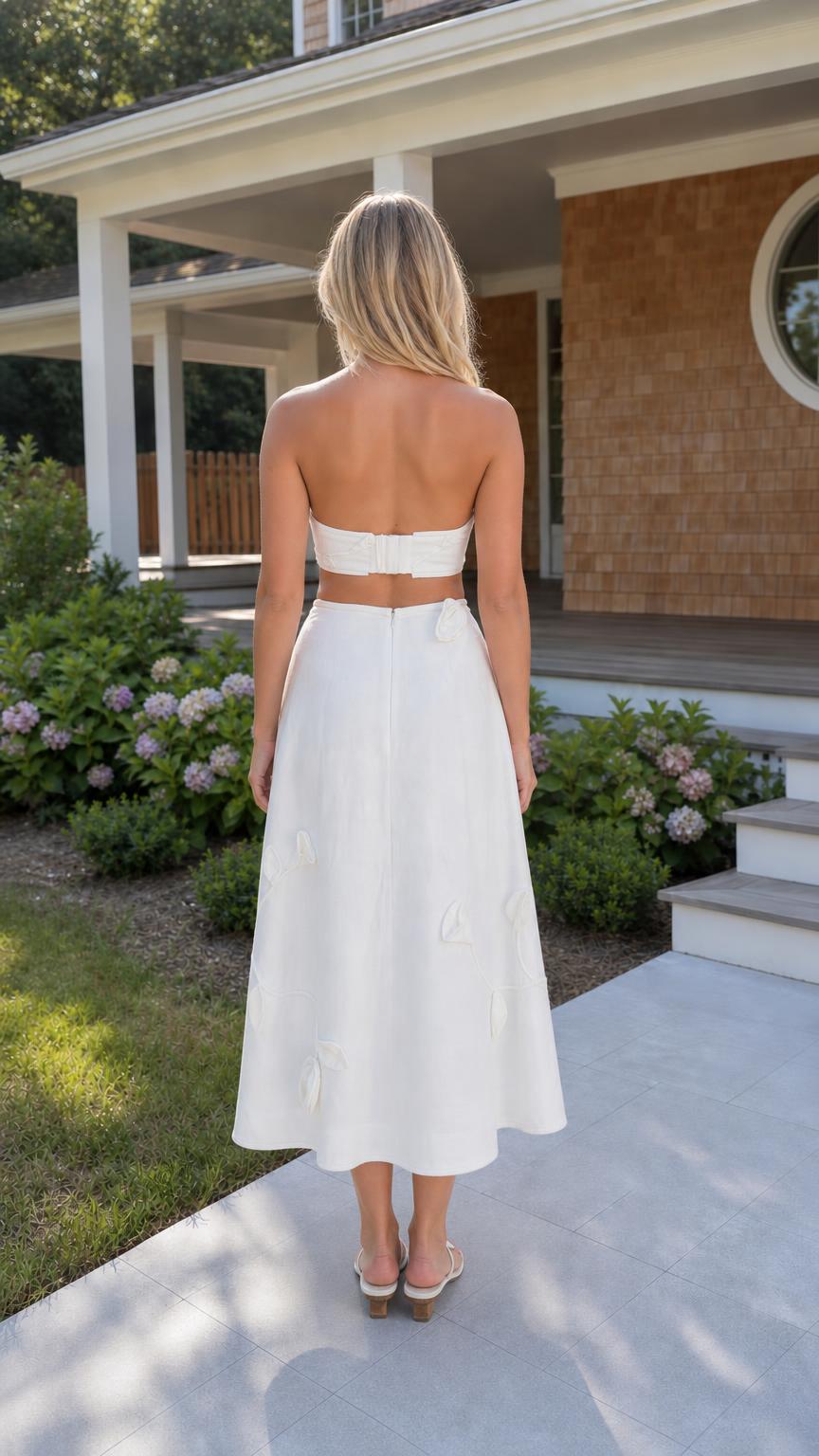 Back view of woman wearing white matching set