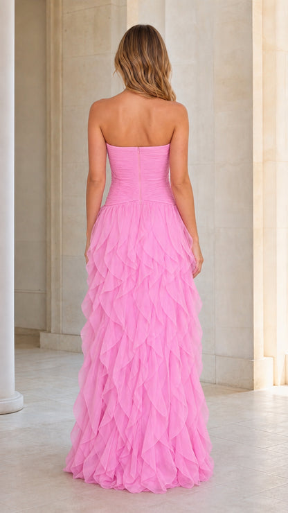 Back view of model in pink tiered ruffle maxi dress