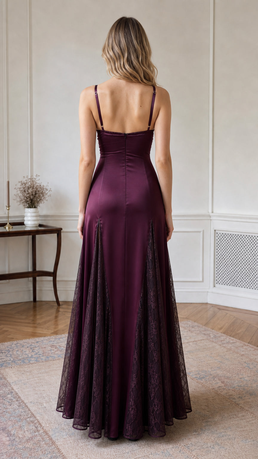 Back view of model wearing burgundy satin floor length dress with low back