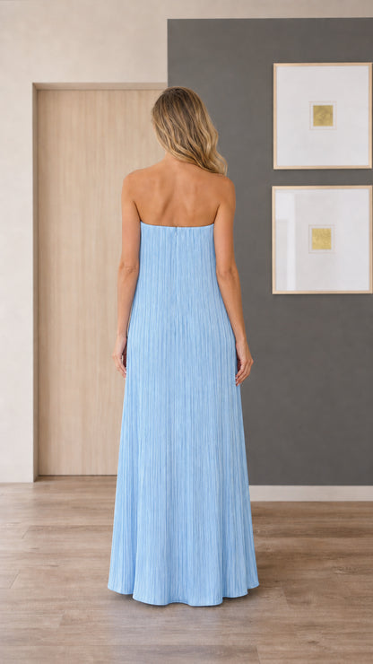 Model wearing light blue strapless pleated maxi dress, back view